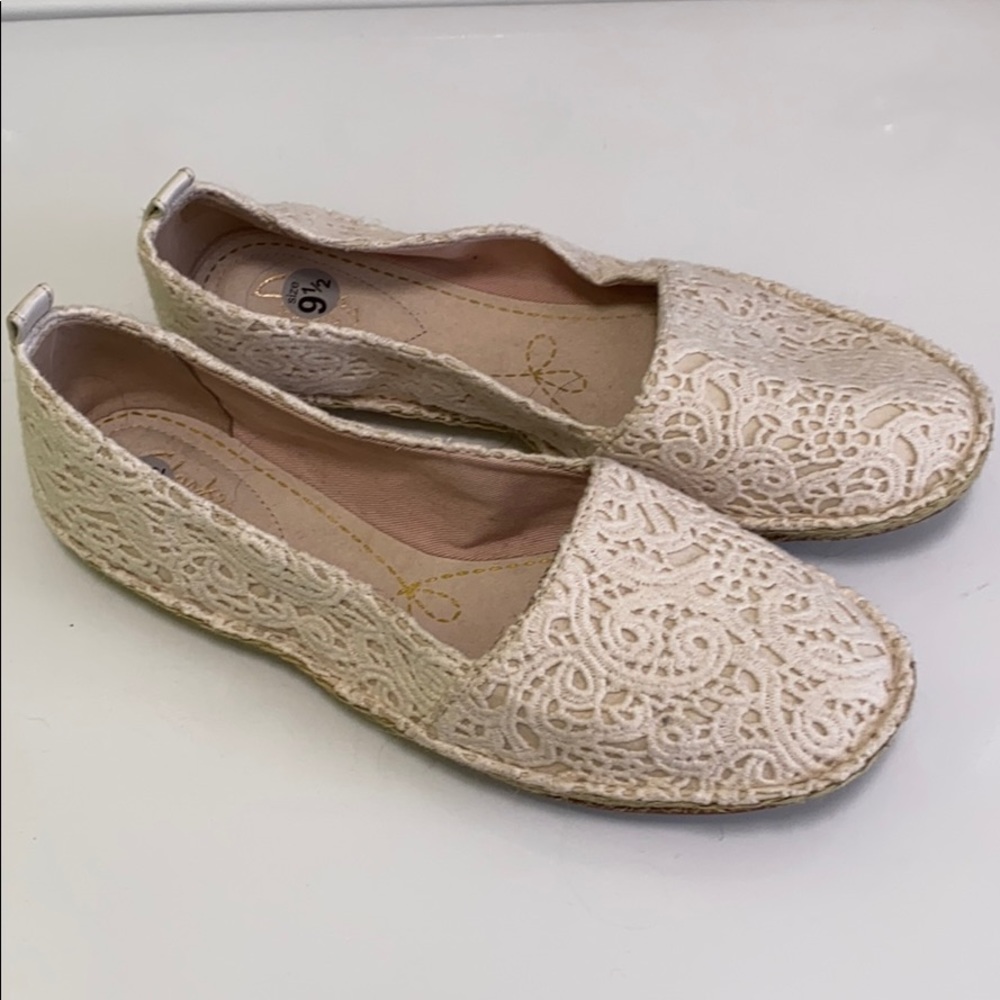 9.5 Clark’s ivory lace slip on shoes